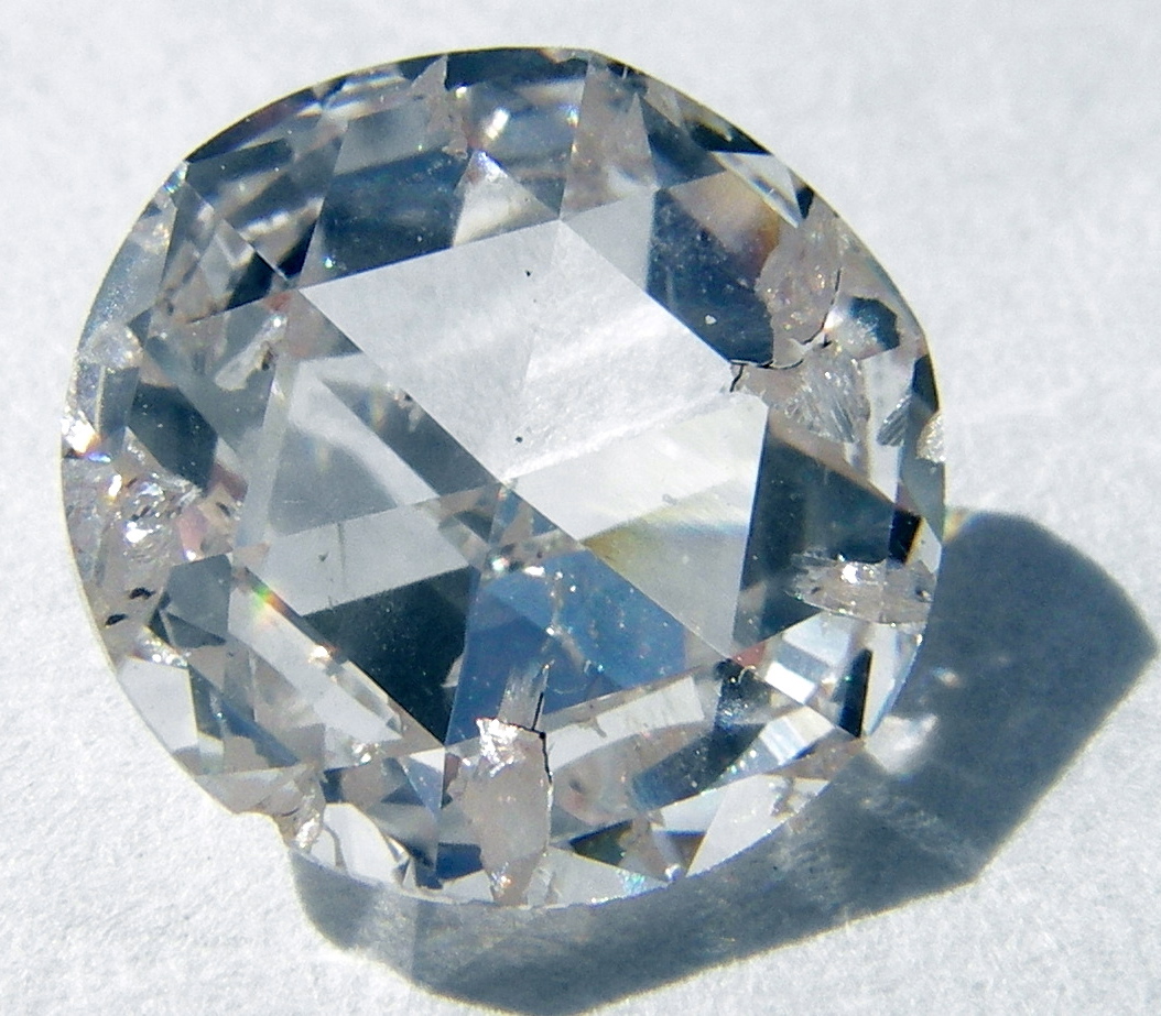A rose-cut synthetic diamond made by chemical vapor deposition, photographed against a white background